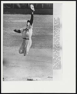 That Old College Try -- The Braves' 6-foot-4 rookie, Len Gabrielson, leaps high to snare a line drive hit by the New York Mets' Cliff Cook in the fourth inning of their game Sunday. Milwaukee edged New York 1-0 in the 10th inning for its third straight victory while the defeat was the Mets' fifth in a row.
