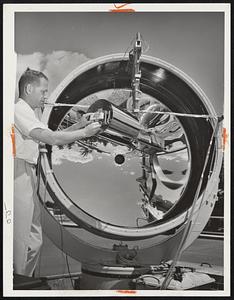Solar Furnace with highly polished reflecting mirror turns sunshine into 7,000 degrees Fahrenheit at Wilmington plant of Avco. Furnace tests missile nose cones, rocket engine nozzles and space craft that must withstand extremely high temperatures.