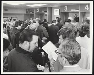 Bettors already studying their race cards line up in front of the windows during a busy afternoon at the recently opened off-track betting office in in New York City. So far betting is limited to trotting events. In most of the 29 states which permit horse and dog racing official or unofficial committees are at work studying New York’s experience with its new off-track parlors. Other states, including New York, are contemplating increases in the legal number of racing days allowed each year.