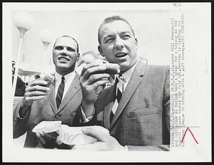 World's Fair. N.Y.: Catcher Bill Freehan (L) and outfielder Al Kaline take a break for a hotdog as the Detroit Tigers toured the Fair 5/4. Freehan is leading the American League in hitting with a .429 average.