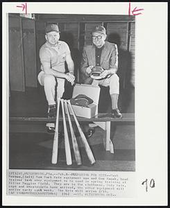 Preparing for Mets--Herb Norman, (left) New York Mets equipment man and Gus Mauch, head trainer look over equipment to be used in spring training at Miller Huggins Field. They are in the clubhouse. Only bats, caps and sweatshirt have arrived, the other equipment will arrive early next week. The Mets will arrive 2/18.
