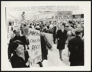 Anti-Viet Nam War demonstrators crash the Easter Parade near St. Patrick's Cathedral 4/10. Autumn like weather brought out more furs than feathers, but the annual parade of fashions on New York's Fifth Avenue was enjoyed by all.