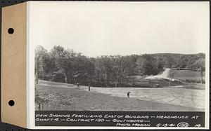 Contract No. 130, Grading, Loaming, and Grassing Vicinity of Shaft 4, Pressure Aqueduct, Southborough, and Improvement of Access Roads to the Intake Works and at Norumbega Reservoir, Marlborough, Southborough, Weston, view showing fertilizing east of building, headhouse at Shaft 4, Southborough, Mass., May 15, 1941