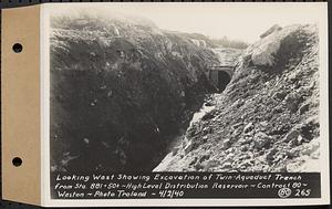 Contract No. 80, High Level Distribution Reservoir, Weston, looking west showing excavation of twin aqueduct trench from Sta. 881+50+/-, high level distribution reservoir, Weston, Mass., Apr. 2, 1940