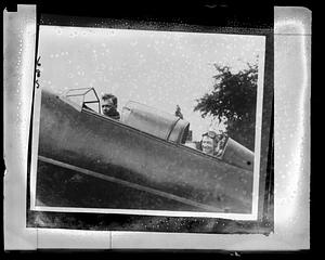 Charles Lindbergh and an unidentified man in the cockpit of an airplane