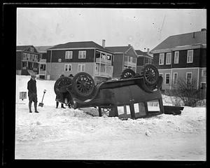 Overturned automobile in the snow