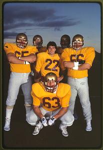 Chestnut Hill, MA 1984 - Quarterback Doug Flutie stands in the middle of his defense team, Boston College, Alumni Stadium
