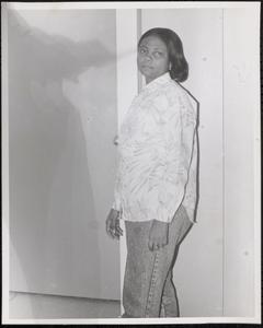 Young woman in button-up shirt