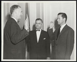 Fingold Asssistants Sworn -- Edward F. Mahony of Boston, right, and Lazarus A. Aaronson of Winchendon, center, were sworn into office as Assistant Attorneys General by Governor Herter. Aaronson's was a reappointment.