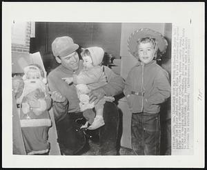 Sisler Busy Man These Days--Major League ball player Dick Sisler points out Santa Claus to his 18-month-old daughter Kathy while his other daughter Shari, five, stands nearby today. Sisler is keeping mighty busy off-season, selling anything from bonds to Christmas decorations. Only yesterday he was named a special policeman in suburban Brentwood.