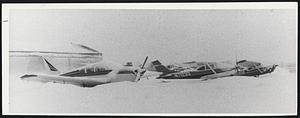 Socked in Solid by Snow Were These Planes Outside Hanger at Norwood Airport.