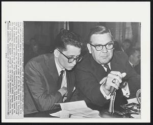 Another Refusal at Klan Hearing--Arthur Robert Nix, left, studies papers and Lester Chalmers, right, Klan counsel, holds his hand over microphone at yesterday's probe of the Ku Klux Klan in Washington by the House Committee on Un-American Activities. Nix was identified by the committee as an officer of the Spartanburg, S.C., klavern known as the Spartanburg Sportsmen's Club, and son-in-law of Grand Dragon Don Cothran of Florida. Nix sought refuge in the Fifth Amendment in refusing to answer committee questions.