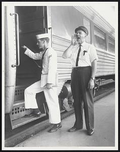 Reliable Rails-Seaman Russell D. Mitchell of 5 Riverview Rd., Hingham, boards the New Haven’s Gilt Edge at South Station, bound for New York, as Conductor Ben J. Rubino of New London sounds the familiar, “All Aboard.” Mitchell beat the strike-caused crush at Logan International Airport by taking the train.