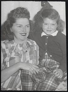 Mrs. Connie Ryan really enjoyed staying indoors chatting and reading with her charming four-year-old daughter Sharon.