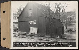 Contract No. 71, WPA Sewer Construction, Holden, wooden outbuilding at Holt Coal Co. yard used as carpenters shop and garage, looking westerly from Boston and Maine Railroad tracks, Holden Sewer, Holden, Mass., Dec. 5, 1939
