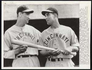 Gets Chance with Reds--Hank Sauer (left), who came to the Cincinnati Reds as an outfield candidate, is getting his chance on first base while Frank McCormick is laid up with injuries. Sauer starred at first with Birmingham in the Southern Association, hitting .330 and driving in 114 runs last year. Above, he checks over the situation with hard-hitting catcher Ray Lamanno, also a Birmingham product.