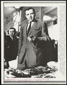 Kent, O.- Portage County Prosecutor Ronald J. Kanes holds up a antique dagger, one of sixty assorted knives confiscated from dormitory room s at Kent State University. A search of rooms vacated after four KSU students were shot to death 5/4 turned up a small number of guns, knives and drugs.