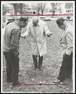 Dowser Scores-On village green in Danville, Vt., scene of convention of American Society of Dowsers, Ellwood T. Perin of Brookline, N.H., says his forked apple twig shows there is water below. Nobody checked.