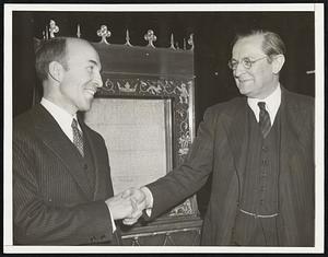 Magna Carta Kept in United States for Safety. Because of war-troubled seas the most legible copy of England's famed Magna Carta, which had been on display at the New York world's fair, was committed, Nov. 28, to temporary custody of the Library of Congress in Washington. Here Archibald Mac Leigh (left), Librarian, acknowledges acceptance of the document (shown behind them) from Lord Lothian, British Ambassador to the United States. The charter of English liberties was placed opposite the constitution and declaration of independence.