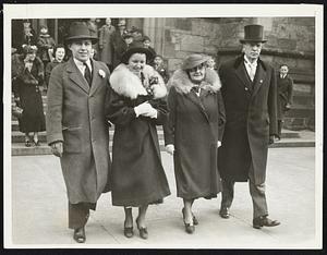 Mayor and Mrs. Mansfield and their son and daughter-in-law Mr. and Mrs. Walter R. Mansfield of New York, leaving the Cathedral of the Holy Cross after attending Easter mass yesterday.