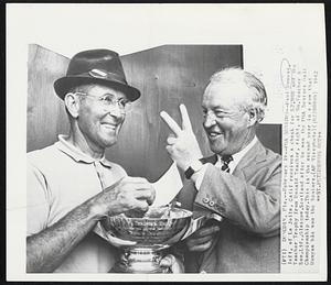 PGA Seniors--Paul Runyan, left, of La Jolla, Calif receives a check for $2,000 and the Teacher Trophy from Ronald Teacher, right, of Wm.Teacher & Son,Ltd.,Glasgow, Scotland after he won the PGA Seniors Golf Championship today.This is the second year in a row that Runyan has won the Seniors.