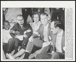 Clergymen to Protest-- These five clergymen, including a woman, link arms as they sit outside construction site of Downstate Medical Center, today. in the borough of Brooklyn, New York City. The purpose of the demonstration was to seek more jobs for Negroes and Puerto Ricans in the construction industry. Picketing has been going on for the last 23 days at several places in New York City in pro-