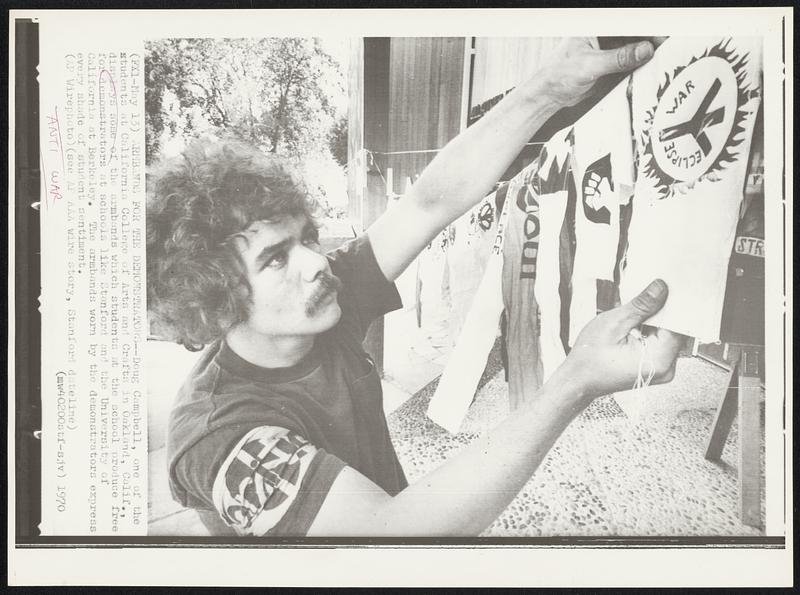 Armbands for the Demonstrators--Doug Campbell, one of the students at California College of Arts and Crafts in Oakland, Calif., displays some of the armbands which students at the school produce free for demonstrators at schools like Stanford and the University of California at Berkeley. The armbands worn by the demonstrators express every shade of student sentiment.