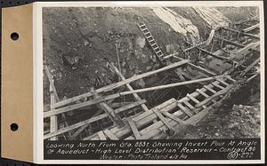 Contract No. 80, High Level Distribution Reservoir, Weston, looking north from Sta. 883+/- showing invert pour at angle of aqueduct, high level distribution reservoir, Weston, Mass., Apr. 5, 1940