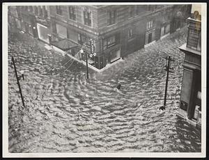 The city of Norfolk, Va., was flooded by a several foot rise in tide caused by the hurricane sweeping up the Atlantic coast. This view was made at Granby and City Hall streets.