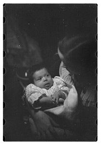 Mercedes Pasarell Sanromá holding a baby