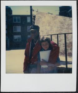Young man with arm around his friend
