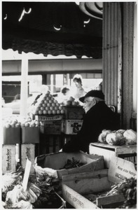 Vendor at a fruit and vegetable stand in the North End