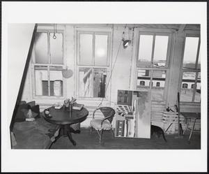 Artist and cat in studio, Fort Point Channel area