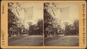 American flag with "Grant & Wilson" banner attached to bottom flying over center of street, 1872