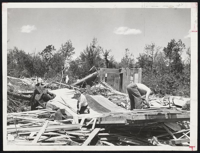 Undismayed at the flatness of their home on Brentwood drive, Holden, Mr. and Mrs. Charles Stanley yesterday started cleaning up preparatory to rebuilding after the tornado.