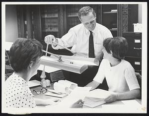 Proof Positive-- Every piece of legislation passed by the House and Senate must be typed on parchment paper and carefully proof read for errors before going to the governor for his signature. Ann McDonough, left, of Dorchester, and Judy Dooley of Dorchester take a break from proof-reading to chat with their boss, State Secretary Kevin White.