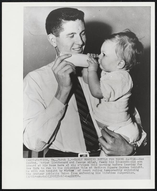 Early Morning Bottle for Young Santee--Wes Santee, Marine Lieutenant and famous miler, feeds his 10-month-old son Edward at his home here at six o'clock this morning before leaving for New York to run in the Columbian Mile at Madison Square Garden tonight. He will run tonight by virtue of court ruling temporarily enjoining the Amateur Athletic Union from enforcing his lifetime suspension.