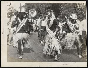 Zulu's Hepcats-Members of the court of King Zulu give with a little jive in the parade which marks the high spot in the Negro celebration of Mardi Gras at New Orleans.