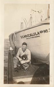 Unidentified seaman with dog "Jackie" on S.S. Noccalula