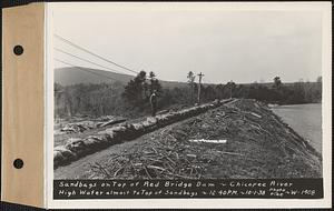 Sandbags on top of Red bridge dam, high water almost to top of sandbags, Three Rivers, Palmer, Mass., 12:40 PM, Oct. 1, 1938