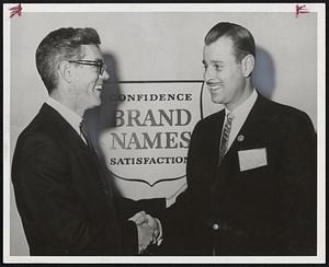 Receives Award -- Herbert A. Abramson, right, president of Silver Lake Dogde of Newton, was recipient of the National Certification of Distinction at the Brand Names Foundation annual awards banquet in Chicago. Congratulating him is Albert H. Messer, national president of the Brand Names Foundation.