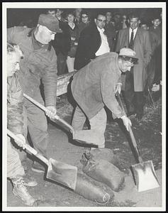 Sandbag's + shovels of clay + dirt to stop rise of water