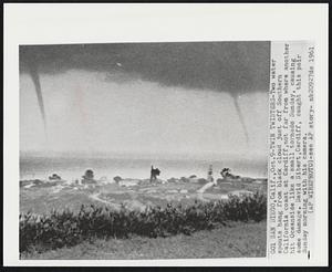 Twin Twisters-Two water spouts hang from black cloud just off Southern California coast at Cardiff, not far from where another hit Oceanside like a small tornado Sunday, causing some damage. David Sibert, Cardiff, caught this pair Sunday morning with his camera.