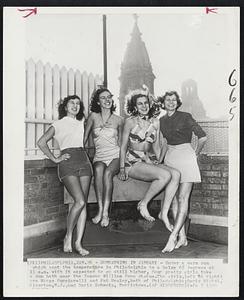 Philadelphia - Sunbathing In January - Under a warm sun which sent the temperature in Philadelphia to a balmy 65 degrees at 11 a.m. with it expected to go still higher, four pretty girls take a sun bath near the famous William Penn statue. The girls, left to right: are Marge Pucciarelli and Pat Mealey, both of Philadelphia; Doris Michel, Riverton, N.J., and Doris Scheetz, Norristown.