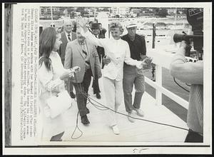 Tokyo-to-California Sailorette Welcomed-Sharon Sites Adams walks ashore with her husband Al (right) after crossing the Pacific alone in a 31-foot sailboat. She became the first woman to make the Japan-to-United States crossing alone. The 5,618-mile voyage took 74 days and 17 hours.