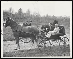 Mayor Tobin Goes Native on visit to Berkshires – takes to horse and buggy in his campaign for Governor. Picture shows mayor (wearing dark suit in nearest carriage) stopping for a chat with Rep. Daniel Casey (D.), Joseph F. Biladeau, 82, of Pittsfield, rides with the mayor.