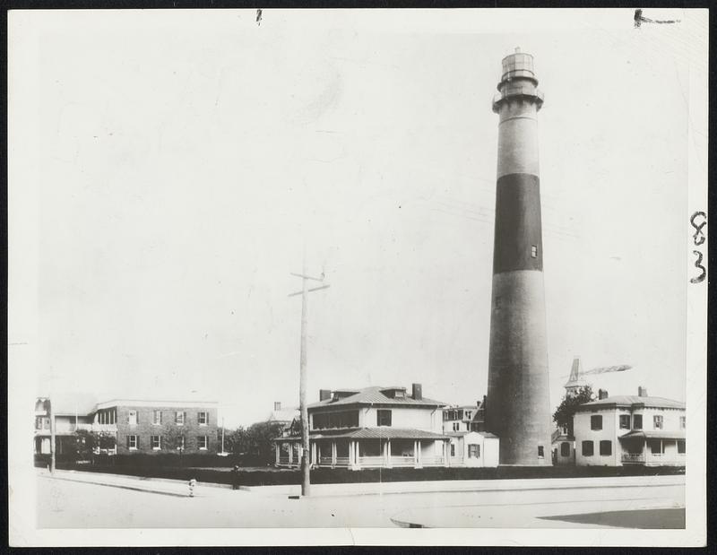 Lighthouse for Sale. The old Absecon lighthouse (above) is to be sold by the federal government. Since it was built 80 years ago, the shore line has been pushed back by the waves and man's industry and the lighthouse now is in Atlantic City's business district, rendering it useless to navigators.The Treasury will ask bids on it on Dec.15