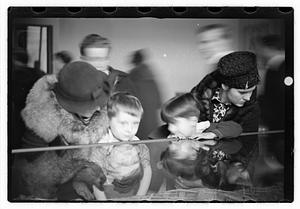 People including Maude Sanromá looking at exhibits, Museum of Fine Arts