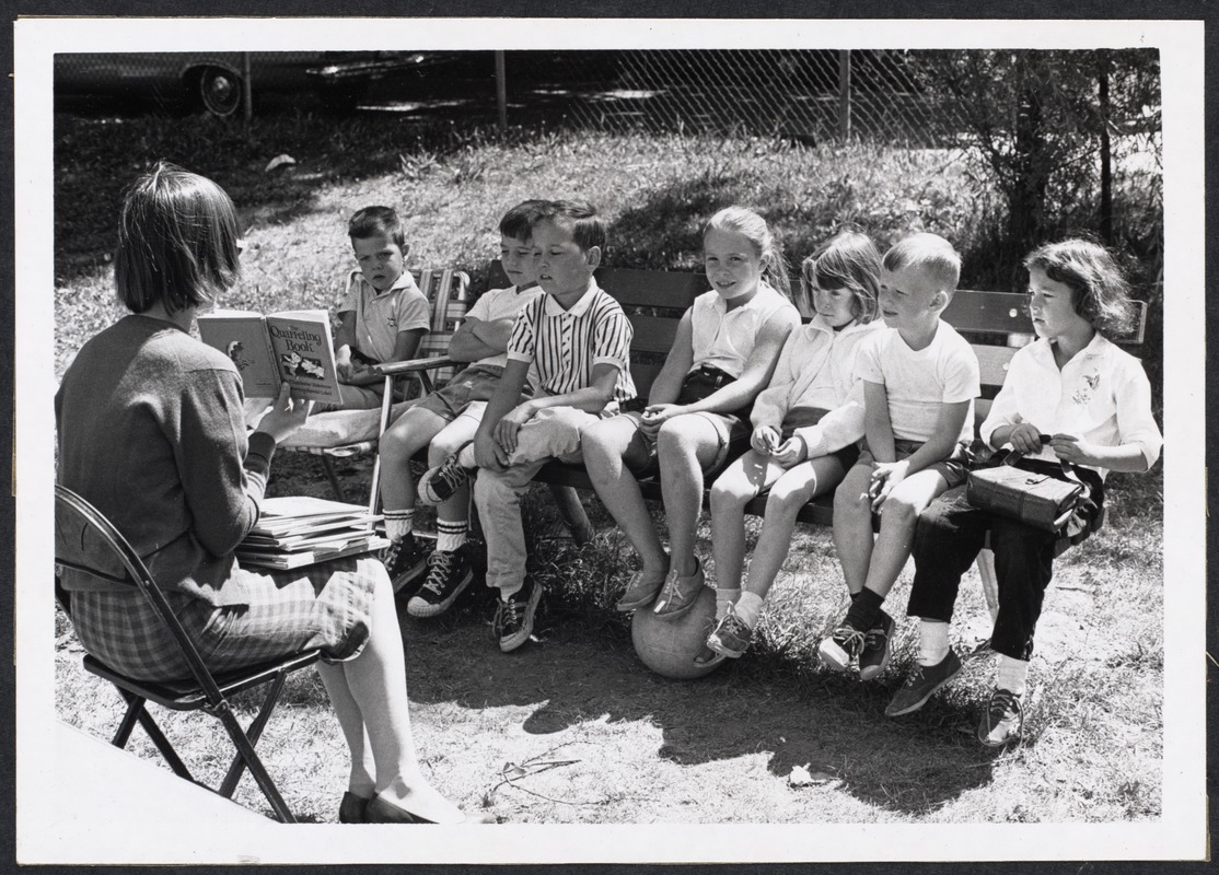 Librarian reading to children at Griggs Playground