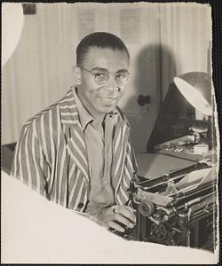 Jack Miller at a typewriter